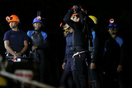Thai divers gather before they enter to the Tham Luang cave, where 12 boys and their soccer coach are trapped, in the northern province of Chiang Rai, Thailand, July 6, 2018. REUTERS/Athit Perawongmetha