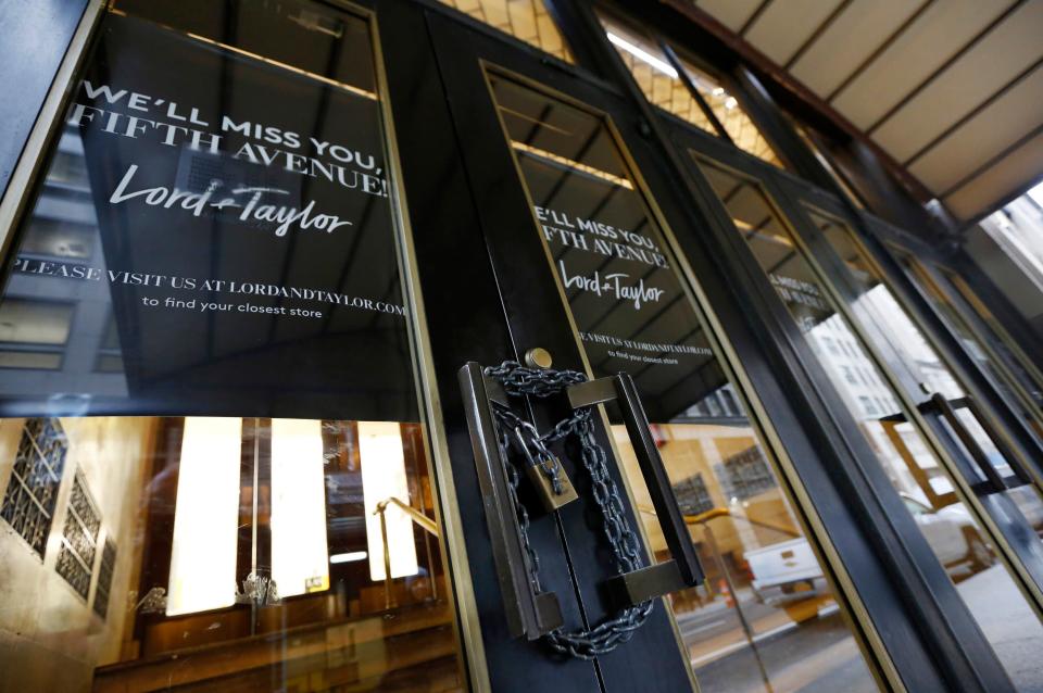 FILE - In this Jan. 2, 2019 file photo, a padlock secures a set of doors on a side entrance to Lord & Taylor's flagship Fifth Avenue store which closed for good in New York. A  key research firm says announced U.S. store closures this year are already exceeding the total for 2018. Coresight Research, which tracks store openings and closing, says retailers have announced 5,994 store closures and 2,641 store openings as of early April. That compares to 5,864 closures and 3,239 openings for the full year 2018.  (AP Photo/Kathy Willens)