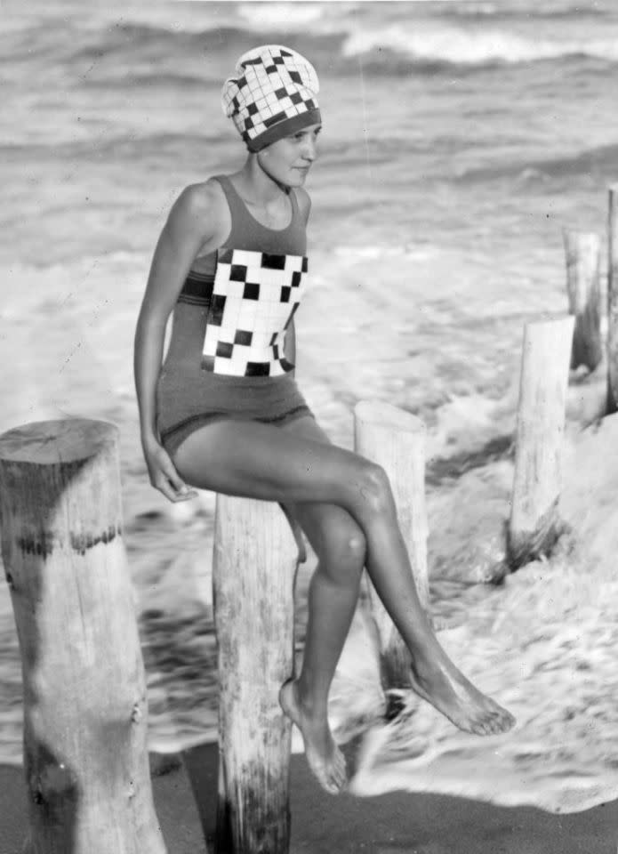 Circa 1933: Verna Lee Fisher sporting her newly created crossword swimsuit with matching bathing hat, at Palm Beach, Florida. (Photo by General Photographic Agency/Getty Images)