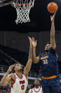 UTEP forward Derick Hamilton (32) shoot against Western Kentucky forward Rodney Howard (0) during the first half of an NCAA college basketball game at the Conference USA Tournament final, Saturday, March 16, 2024, in Huntsville, Ala. (AP Photo/Vasha Hunt)