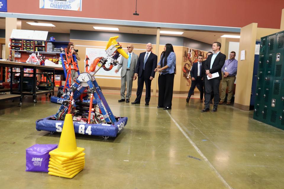 Former Vice President Mike Pence takes a tour of students' projects on Thursday, May 25, 2023, at Career Academy South Bend.