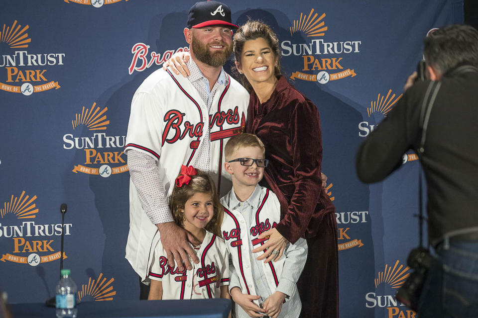 Brian McCann and his wife Ashley McCann pose for a photo with their two children Colt, right, and Colbie following a news conference at the Delta360 Club at SunTrust Park in Atlanta Monday, Nov. 26, 2018. McCann recently signed to a one-year contract with the Atlanta Braves for $2 million. (Alyssa Pointer/Atlanta Journal-Constitution via AP)