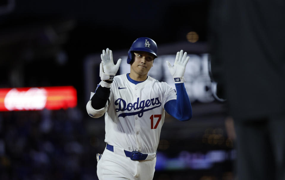 Shohei Ohtani of the Los Angeles Dodgers celebrates after hitting a two-run home run against the Los Angeles Angels at Dodger Stadium on Friday in Los Angeles.  (Photo by Kevork Djansezian/Getty Images)