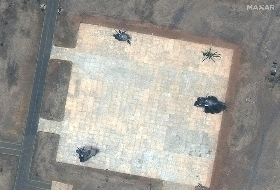 This satellite image provided by Maxar Technologies shows destroyed helicopters at a helicopter base in south Khartoum, Sudan, Tuesday April 18, 2023. (Satellite image ©2023 Maxar Technologies via AP)
