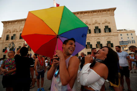 People celebrate after the Maltese parliament voted to legalise same-sex marriage on the Roman Catholic Mediterranean island, in Valletta, Malta July 12, 2017. REUTERS/Darrin Zammit Lupi