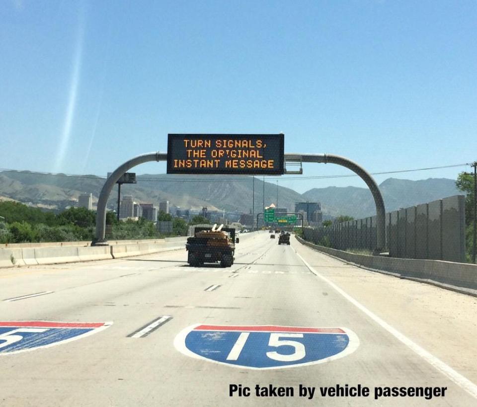 A Utah Department of Transportation roadside safety message saying: "Turn signals, the original instant message."