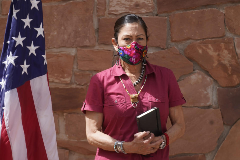 U.S. Interior Secretary Deb Haaland looks on during a news conference following a visit to Bears Ears National Monument Thursday, April 8, 2021, in Blanding, Utah. Haaland is visiting Utah as she prepares to submit a review on national monuments in the state. Residents there have both staunchly supported establishing and increasing the size of national monuments, and fiercely rallied against them. (AP Photo/Rick Bowmer)