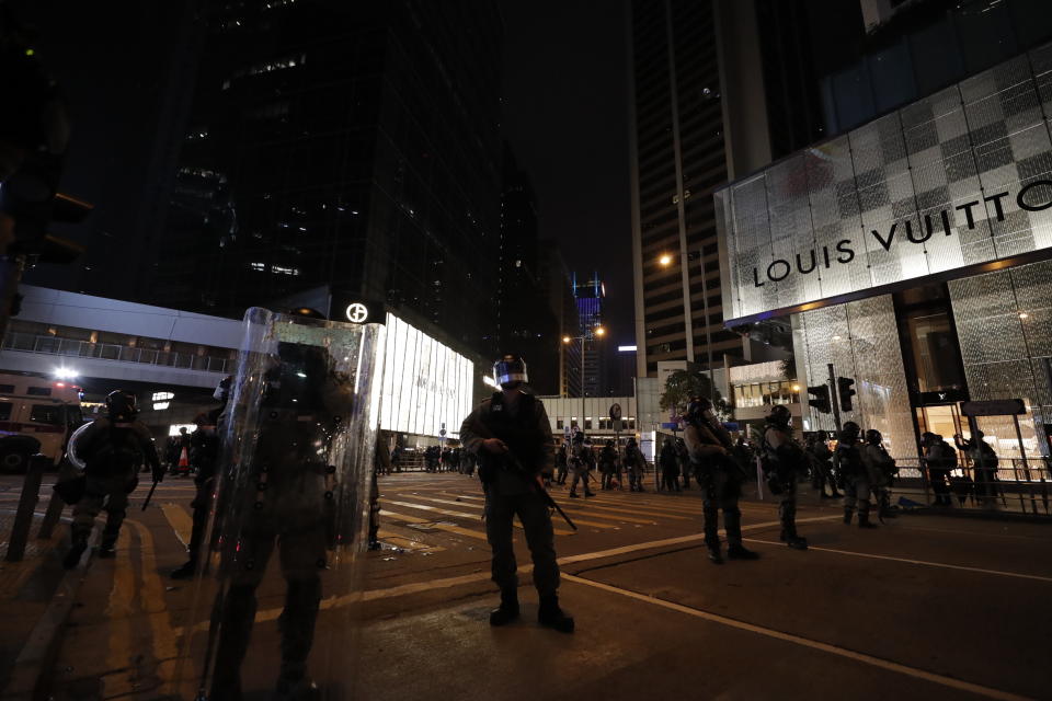 Policemen stand guard in Hong Kong, Wednesday, Jan. 1, 2020. Hong Kong toned down its New Year’s celebrations amid the protests that began in June and which have dealt severe blows to the city’s retail, tourism and nightlife sectors. (AP Photo/Lee Jin-man)