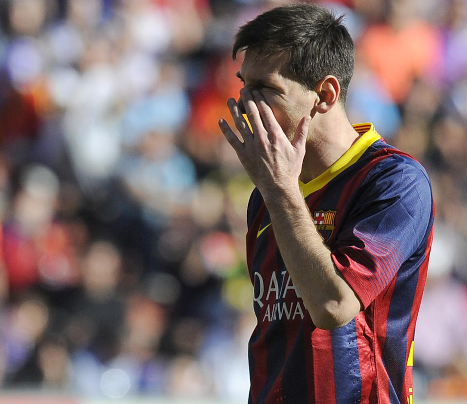 FC Barcelona's Lionel Messi gestures during a Spanish La Liga soccer match against Real Valladolid at the Jose Zorrilla stadium in Valladolid, Spain on Saturday March 8, 2014. (AP Photo/Israel L. Murillo)