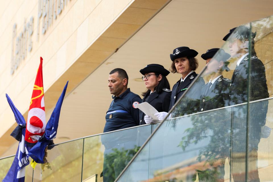 Director of Baumettes Penitentiary Lagier Karine along with members of law enforcement observe a moment of silence on the day of a symbolic one-day shutdown of the country's jails (REUTERS)