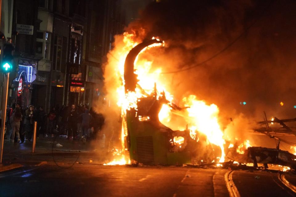 A bus on fire on O’Connell Street in Dublin city centre after violent scenes unfolded following a knife attack on Parnell Square East on Thursday (PA Wire)