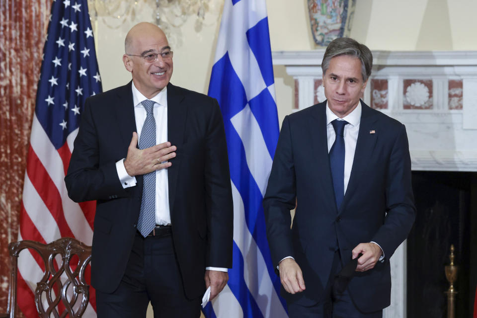 Secretary of State Antony Blinken and Greece's Foreign Minister Nikos Dendias depart after signing the renewal of the U.S.-Greece Mutual Defense Cooperation Agreement at the State Department in Washington, Thursday, Oct. 14, 2021. (Jonathan Ernst/Pool via AP)