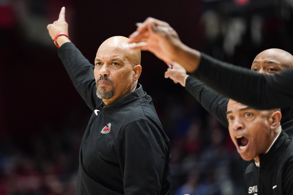 SMU coach Rob Lanier signals possession of the ball by the team during the first half of an NCAA college basketball game against Dayton, Friday, Nov. 11, 2022, in Dayton, Ohio. (AP Photo/Joshua A. Bickel)