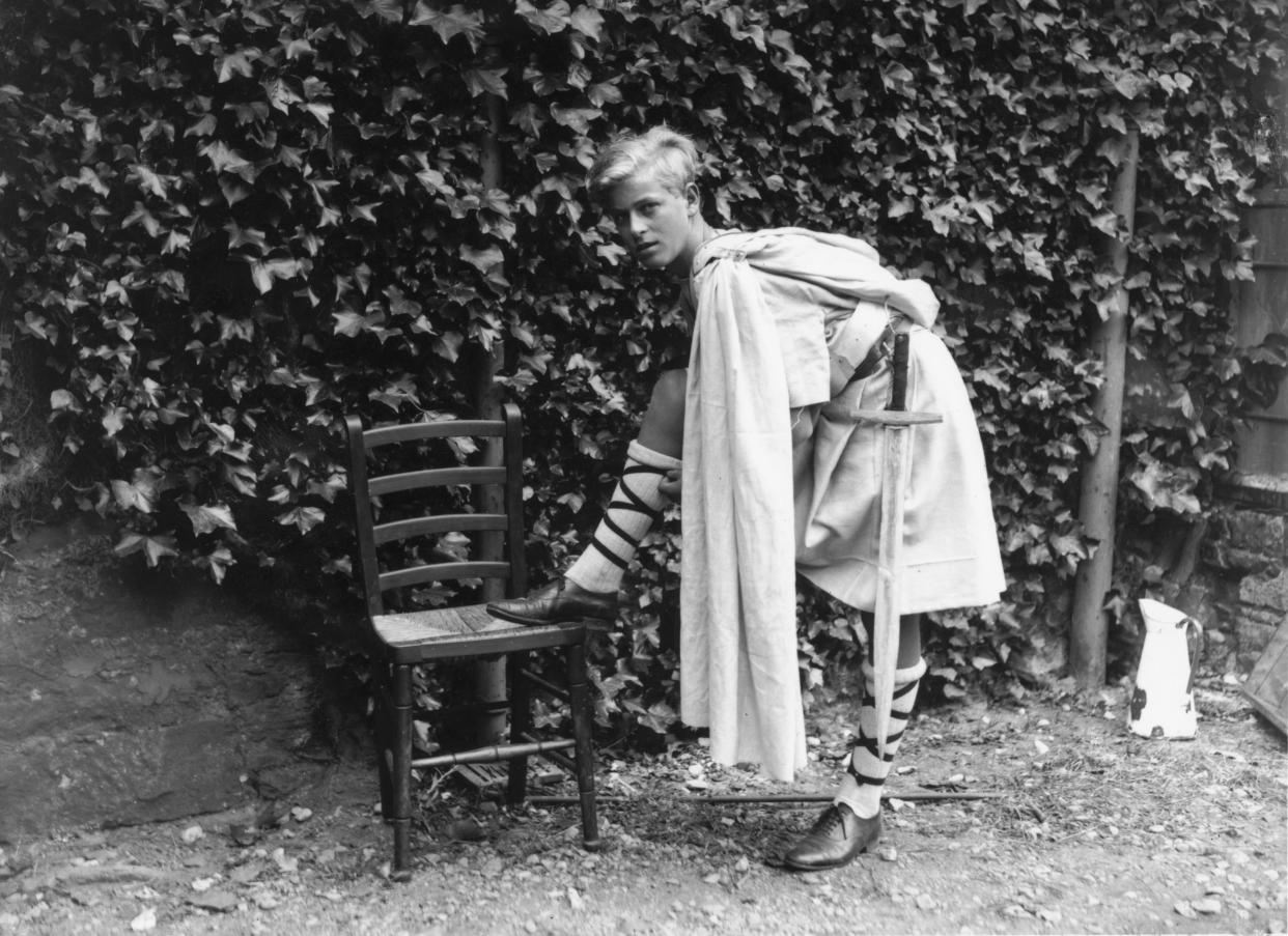 July 1935:  Prince Philip of Greece dressed for the Gordonstoun School's production of 'MacBeth', in Scotland.  (Photo by Fox Photos/Getty Images)