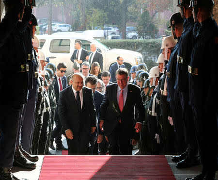 Turkey's Defense Minister Fikri Isik (L) welcomes U.S. Defense Secretary Ash Carter upon his arrival to a meeting in Ankara, Turkey, October 21, 2016. Ozgur Yurdakadim/Prime Minister's Press Office/Handout via REUTERS