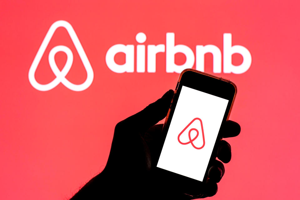 SPAIN - 2021/04/15: In this photo illustration, the Airbnb app seen displayed on a smartphone screen with the Airbnb logo in the background. (Photo Illustration by Thiago Prudencio/SOPA Images/LightRocket via Getty Images)