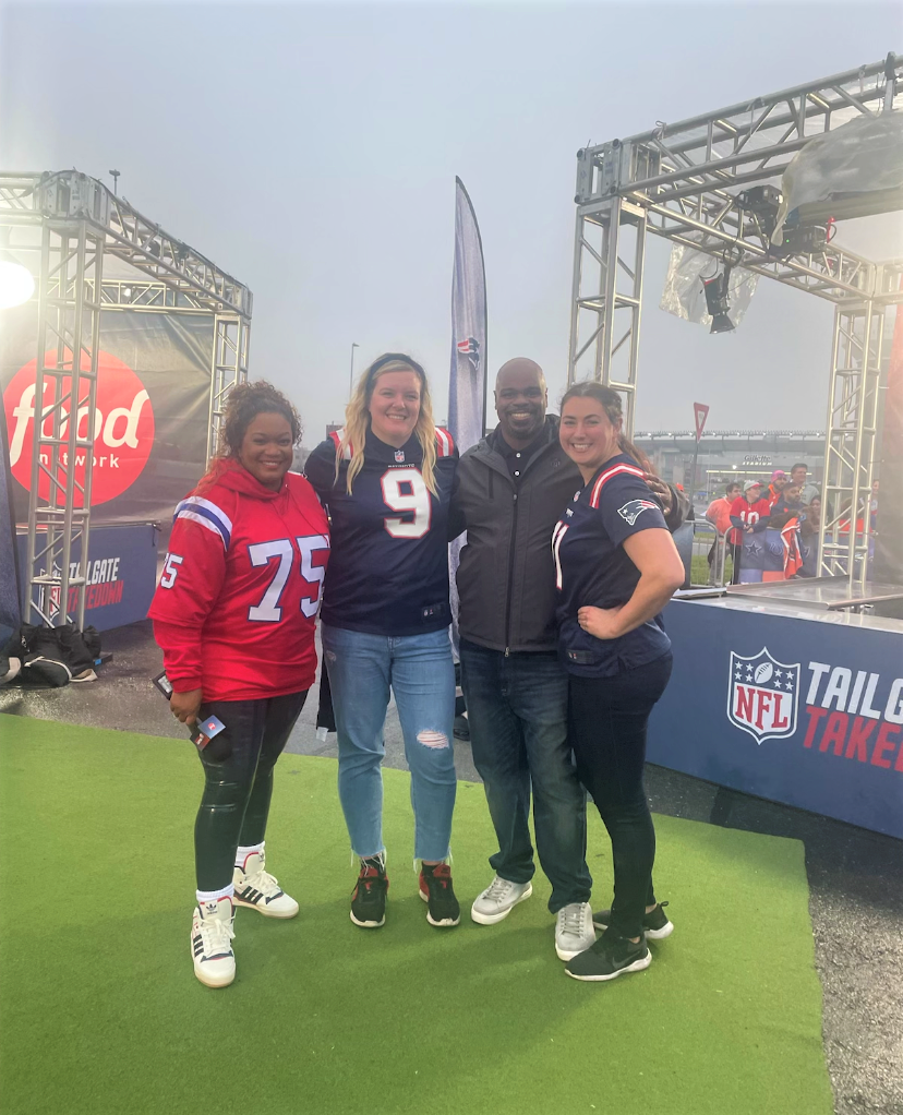 "Tailgate Takedown" hosts Sunny Anderson, left, and Vince Wilfork, second from right, pose with contestants Erin Truex, second from left, and Molly Winsten.