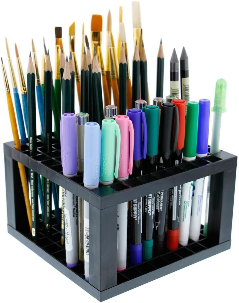 You can keep up to 96 pens, pencils, markers, brushes and other tiny tools upright and organized. <br /><br /><strong>Promising review:</strong> "I love everything about this. It's perfect for my desk. I'm an artist, and I bought two for all my markers. <strong>It's lightweight, very classy-looking, and the price is great.</strong> I put one on each end of my desk. They're small but hold so many markers or pencils." &mdash; <a href="https://amzn.to/3mPiOlw" target="_blank" rel="nofollow noopener noreferrer" data-skimlinks-tracking="5902331" data-vars-affiliate="Amazon" data-vars-href="https://www.amazon.com/gp/profile/amzn1.account.AFEFKFCO355VDXHABREFA7DEVBIQ?tag=bfmal-20&amp;ascsubtag=5902331%2C26%2C37%2Cmobile_web%2C0%2C0%2C16540740" data-vars-keywords="cleaning" data-vars-link-id="16540740" data-vars-price="" data-vars-product-id="15939477" data-vars-retailers="Amazon">Sherrie Stone</a>﻿<br /><br /><strong>Get it from Amazon for <a href="https://amzn.to/3uOuFTC" target="_blank" rel="nofollow noopener noreferrer" data-skimlinks-tracking="5902331" data-vars-affiliate="Amazon" data-vars-asin="B06Y3P5B5V" data-vars-href="https://www.amazon.com/dp/B06Y3P5B5V?tag=bfmal-20&amp;ascsubtag=5902331%2C26%2C37%2Cmobile_web%2C0%2C0%2C16540706" data-vars-keywords="cleaning" data-vars-link-id="16540706" data-vars-price="" data-vars-product-id="17884488" data-vars-product-img="https://m.media-amazon.com/images/I/51S9ffRsVgL.jpg" data-vars-product-title="U.S. Art Supply 96 Hole Plastic Pencil &amp; Brush Holder - Desk Stand Organizer Holding Rack for Pens, Paint Brushes, Colored Pencils, Markers" data-vars-retailers="Amazon">$7.96+</a> (available in two sizes).</strong>