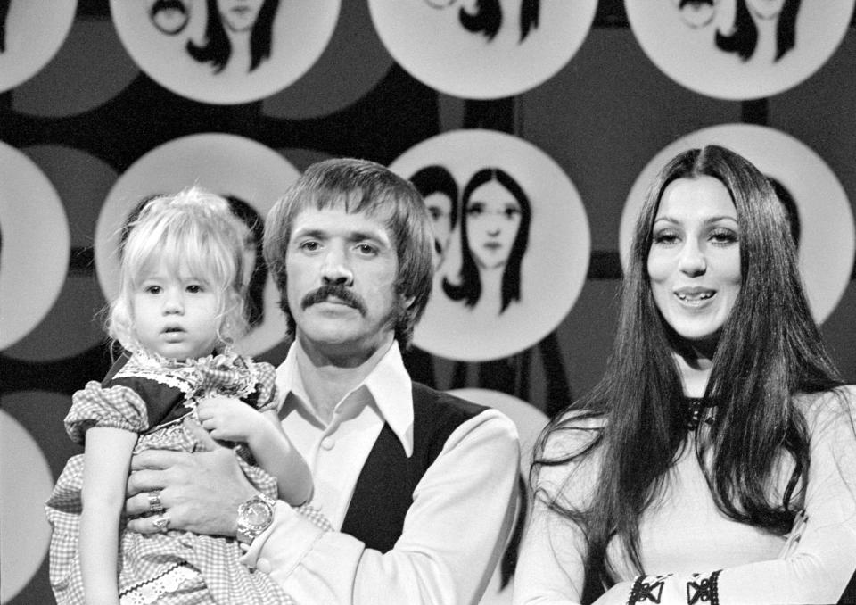 Married American singing and acting duo Sonny Bono (1935 - 1998) (born Salvatore Philip Bono) and Cher (born Cherilyn Sarkisian LaPiere) appear with their daughter Chastity Bono on an episode of the television variety show 'The Sonny and Cher Comedy Hour,' December 17, 1971. (Photo by CBS Photo Archive/Getty Images)