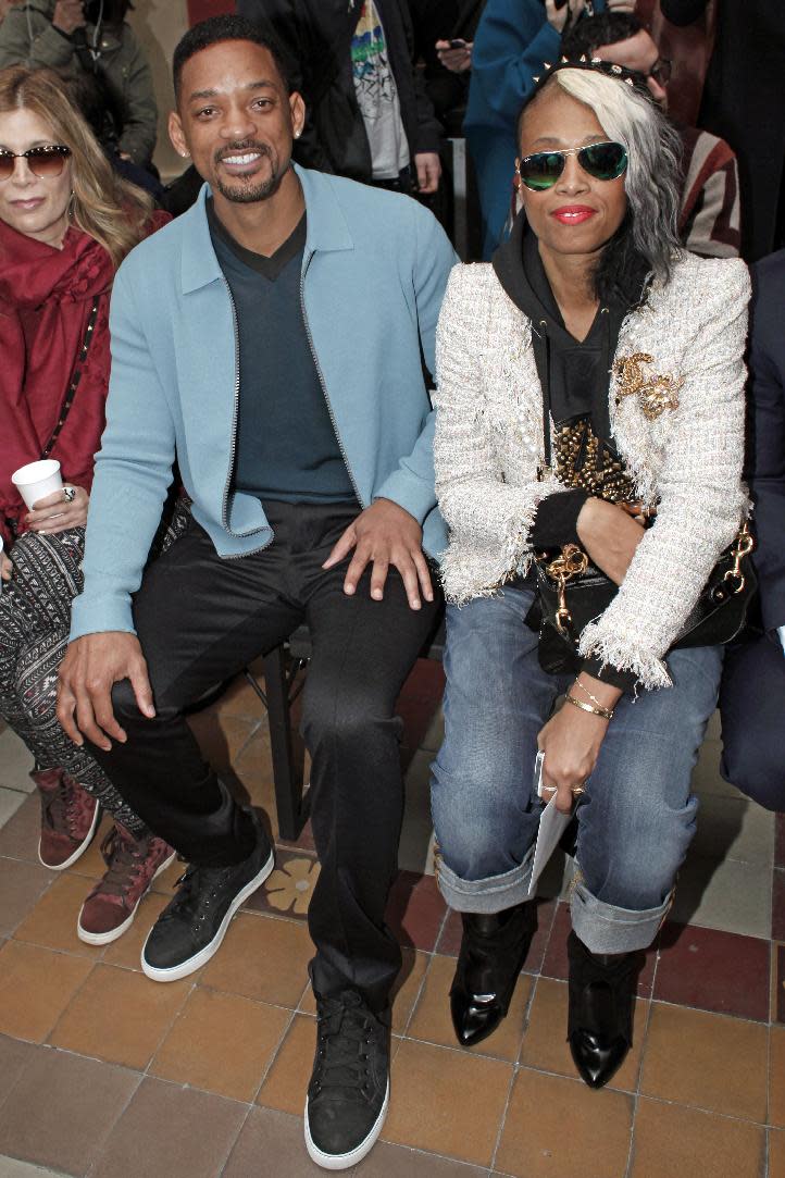 U.S actor Will Smith and a unidentified guest attend the Lanvin men's Fall-Winter 2014-2015 fashion collection, presented Sunday, Jan. 19, 2014 in Paris. (AP Photo/ Thibault Camus)