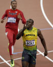 Jamaica's Usain Bolt celebrates after crossing the finish line to win gold in the men's 100-meter final during the athletics competition in the Olympic Stadium at the 2012 Summer Olympics, Sunday, Aug. 5, 2012, in London. (AP Photo/Matt Slocum)