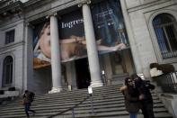 Tourists take a selfie outside El Prado Museum in central Madrid, Spain, January 18, 2016. REUTERS/Susana Vera