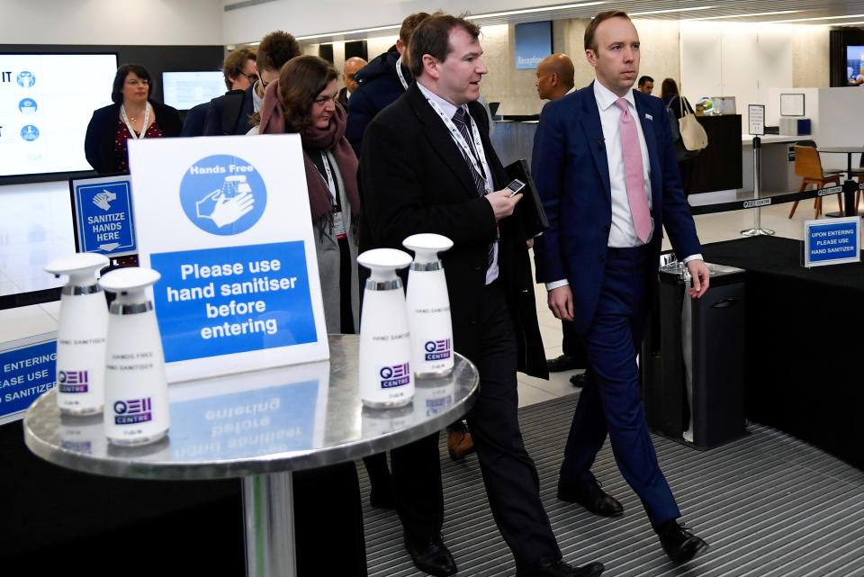 Britain's health minister Matt Hancock walks past a hand sanitising station as he leaves after talking about coronavirus at the annual conference of the British Chambers of Commerce in London, Britain, March 5, 2020. REUTERS/Toby Melville