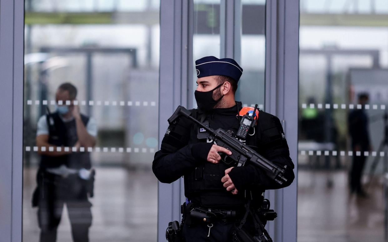 Belgian police officers stand guard at the entrance to Antwerp courthouse ahead of the trial - KENZO TRIBOUILLARD /AFP