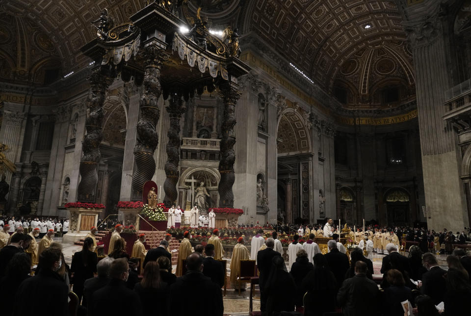 Pope Francis celebrates Christmas Eve Mass, at St. Peter's Basilica, at the Vatican, Friday Dec. 24, 2021. Pope Francis is celebrating Christmas Eve Mass before an estimated 1,500 people in St. Peter's Basilica. He's going ahead with the service despite the resurgence in COVID-19 cases that has prompted a new vaccine mandate for Vatican employees. (AP Photo/Alessandra Tarantino)