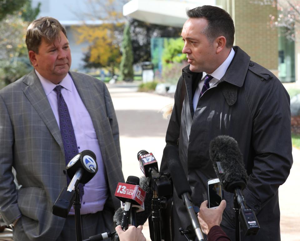 Mark Satawa, left, listens as his co-counsel Gary Springstead speaks to the media outside of the Gerald R. Ford Federal Building and U.S. Courthouse where they spent most of the day arguing for their client Ty Garbin in front of U.S. Magistrate Judge Sally Berens, in Grand Rapids on Friday, Oct. 16, 2020