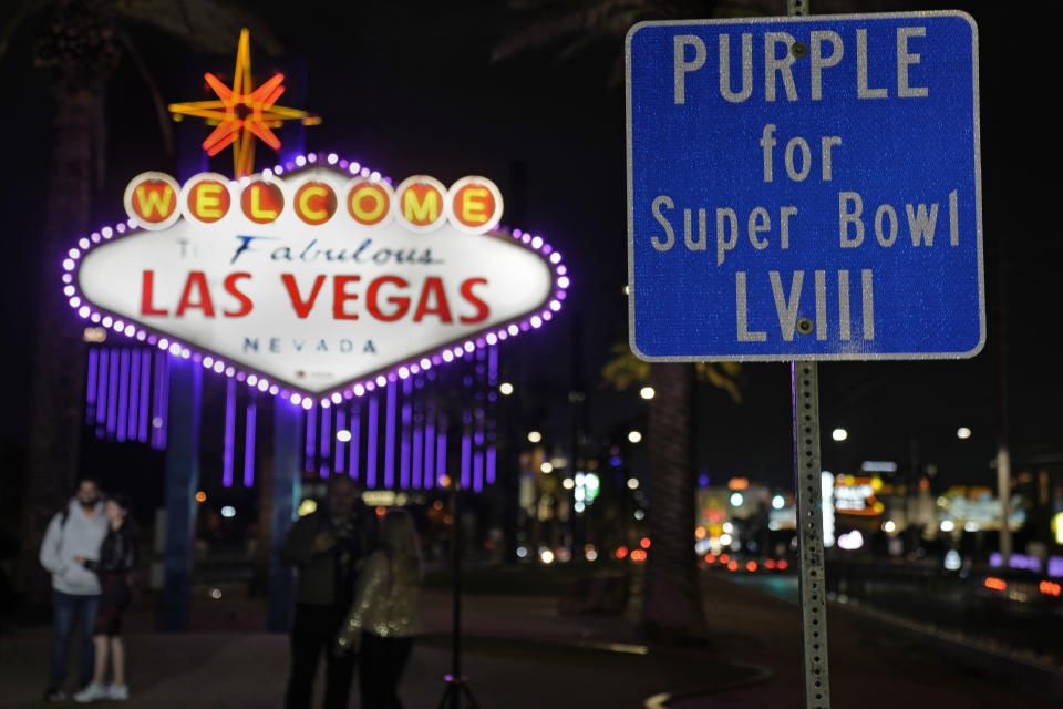 The Welcome to Las Vegas is outlined in purple for the Super Bowl Tuesday, Feb. 6, 2024 in Las Vegas. The city will host the Kansas City Chiefs and the San Francisco 49ers in Super Bowl 58 Sunday. (AP Photo/Charlie Riedel)