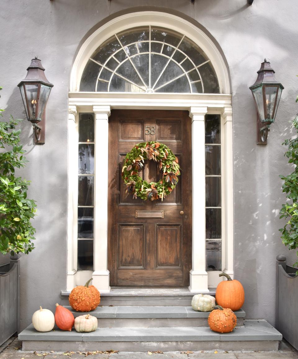 fall front door decor, statement wreath and pumpkins