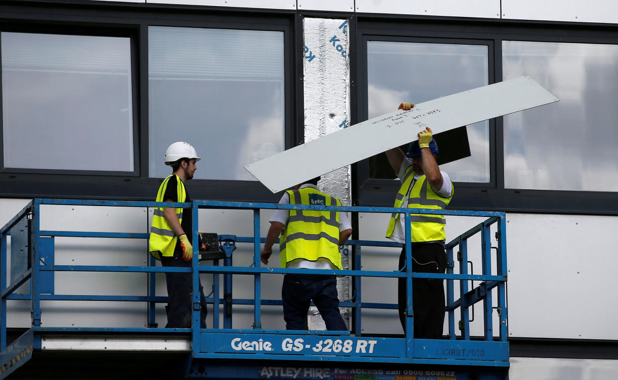 Cladding is removed from the side of Whitebean Court in Salford, Manchester, Britain June 26, 2017. REUTERS/Andrew Yates