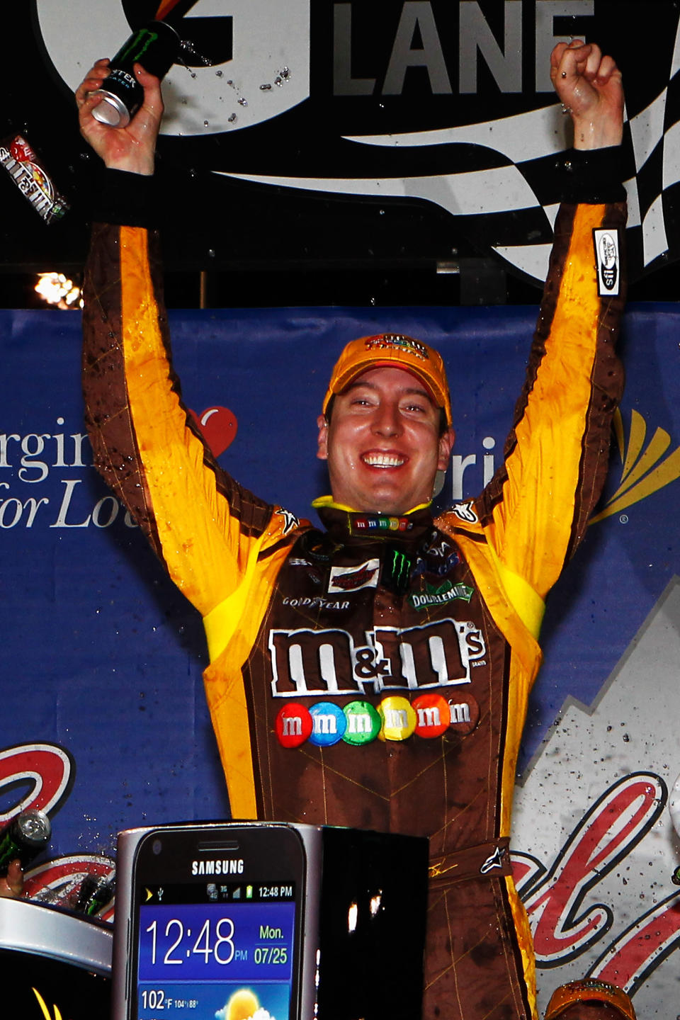 RICHMOND, VA - APRIL 28: Kyle Busch, driver of the #18 M&M's Ms. Brown Toyota, celebrates in Victory Lane after winning the NASCAR Sprint Cup Series Capital City 400 at Richmond International Raceway on April 28, 2012 in Richmond, Virginia. (Photo by Jeff Zelevansky/Getty Images for NASCAR)