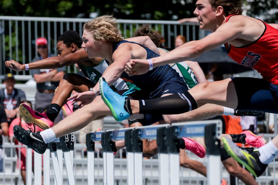 Runners compete in hurdles at the Utah high school track and field championships at BYU in Provo on Thursday, May 18, 2023. | Spenser Heaps, Deseret News