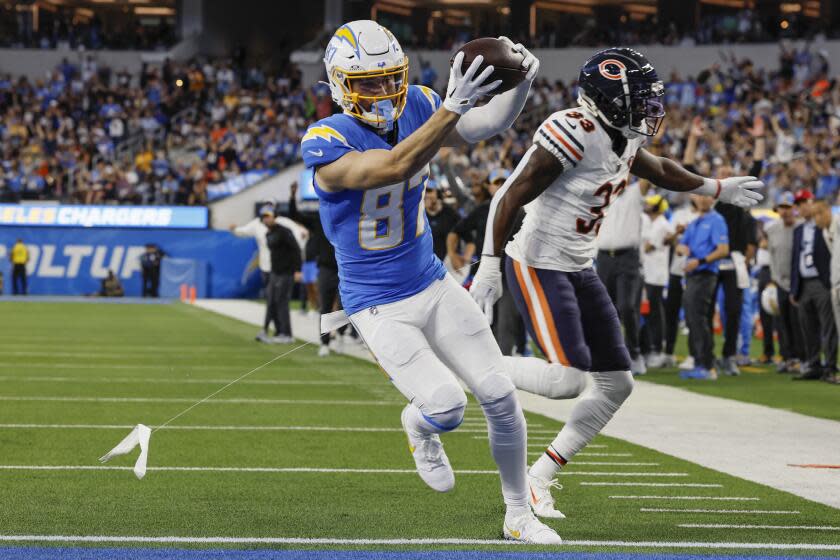 Chargers receiver Simi Fehoko (87) gets past Bears cornerback Jaylon Johnson (33) for a first-quarter touchdown.