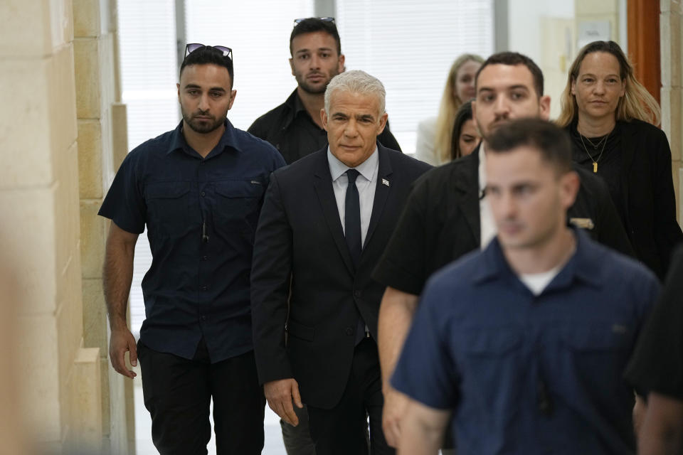 Israeli opposition leader Yair Lapid arrives to testify at the trial of Prime Minister Benjamin Netanyahu on corruption charges at the Jerusalem District Court, in east Jerusalem, Monday, June 12, 2023. (AP Photo/Ohad Zwigenberg)
