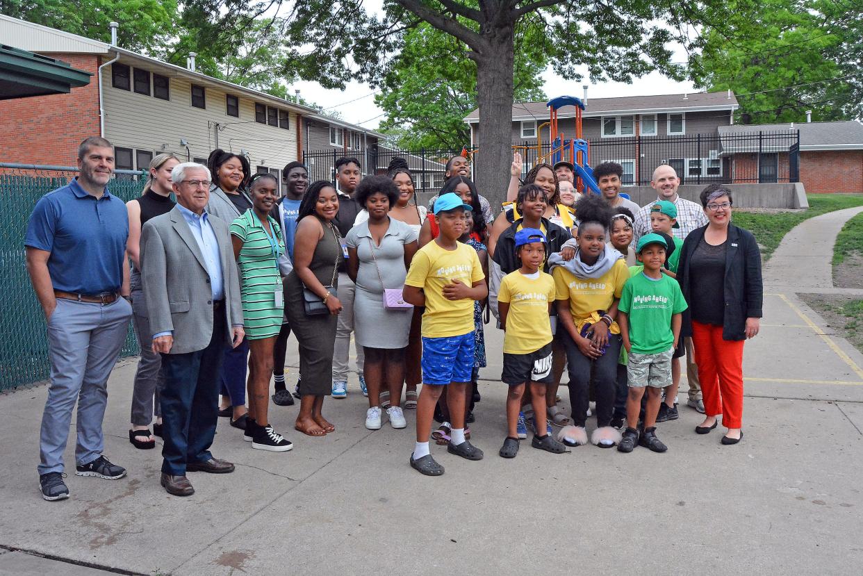 Columbia Housing Authority Moving Ahead Program staff and the students they serve pose for a group photo May 24, 2023 in celebration of the after school and summer education program's 20-year anniversary. Program coordinator Michaela Flores recently was selected as an ambassador for the Missouri After School Network.