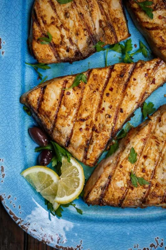 <p>The Mediterranean Dish</p><p>This quick grilled swordfish recipe takes on a delicious Mediterranean twist thanks to a simple olive oil marinade with fresh garlic and a trio of warm spices.</p><p><strong>Get the recipe: <a href="https://www.themediterraneandish.com/grilled-swordfish-recipe/" rel="nofollow noopener" target="_blank" data-ylk="slk:Grilled Swordfish;elm:context_link;itc:0;sec:content-canvas" class="link ">Grilled Swordfish</a></strong></p>