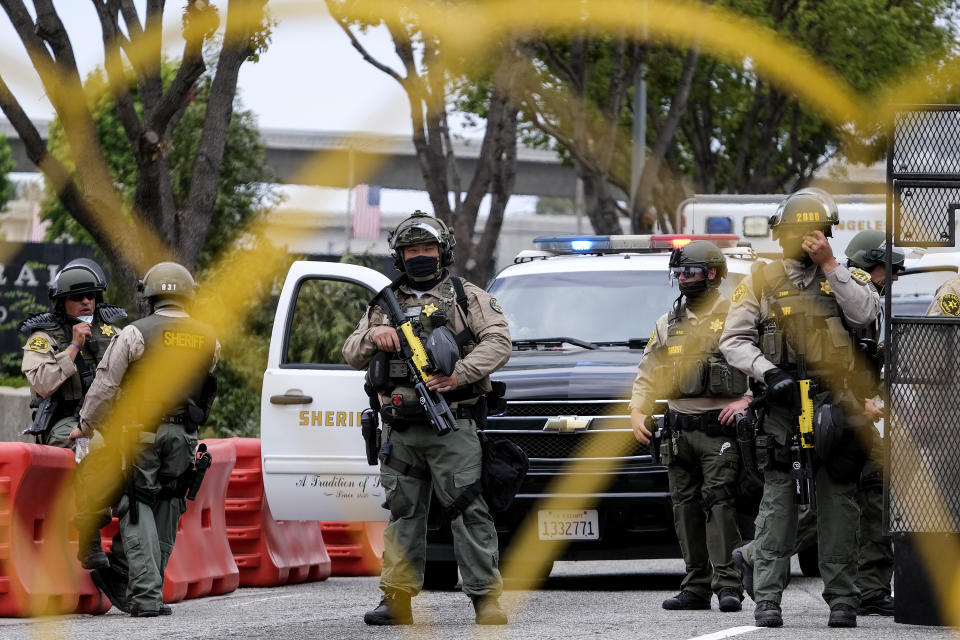 Police officers guard outside the Federal Building during a protest against Israel and in support of Palestinians, Saturday, May 15, 2021, in the Westwood section of Los Angeles. (AP Photo/Ringo H.W. Chiu)