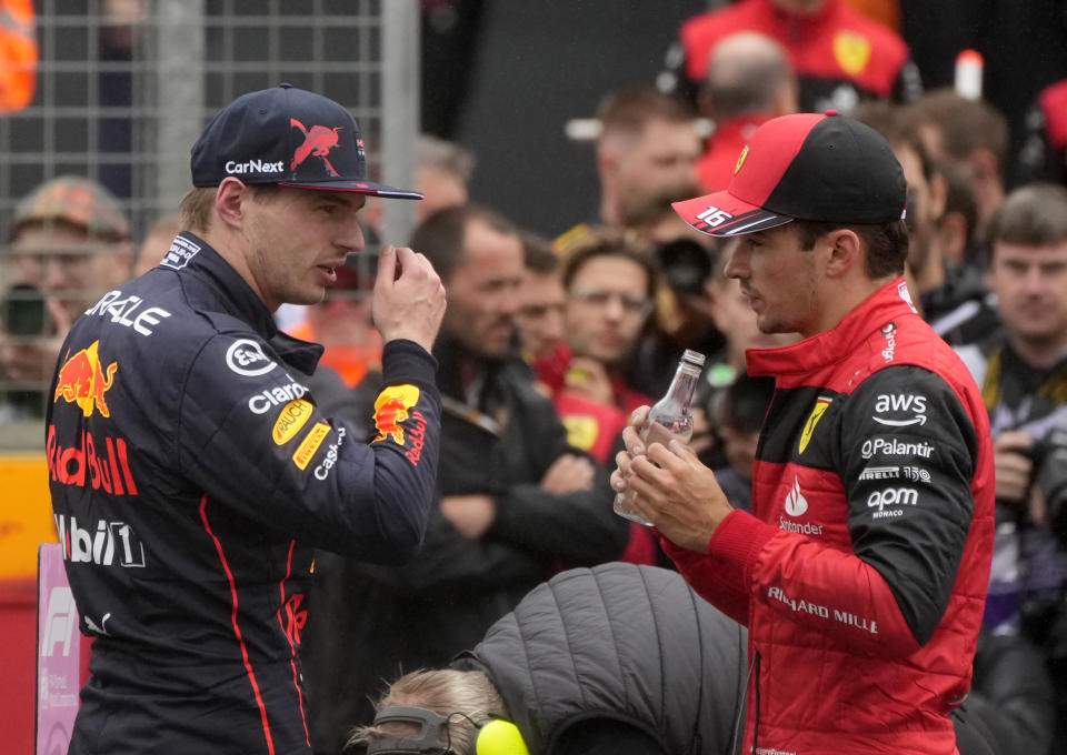 Red Bull driver Max Verstappen of the Netherlands, left, speaks with Ferrari driver Charles Leclerc of Monaco the qualifying session for the British Formula One Grand Prix at the Silverstone circuit, in Silverstone, England, Saturday, July 2, 2022. The British F1 Grand Prix is held on Sunday July 3, 2022. (AP Photo/Frank Augstein)