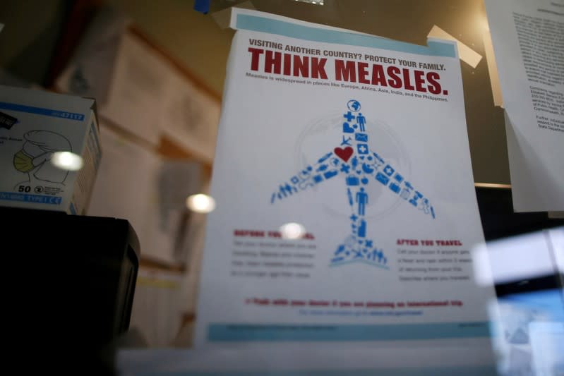 FILE PHOTO: Measles poster is seen at Venice Family Clinic in Los Angeles