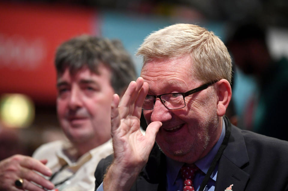 Len McCluskey, General Secretary of Unite the Union, gestures while sitting in the audience during the Labour Party Conference at the Brighton Centre in Brighton.