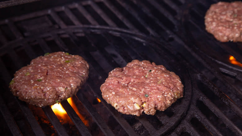 burger patties on grill