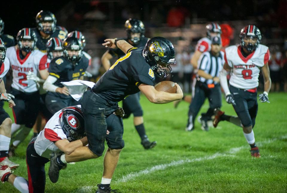 Colonel Crawford's Lincoln Mollenkopf shakes off a Bucyrus defender.