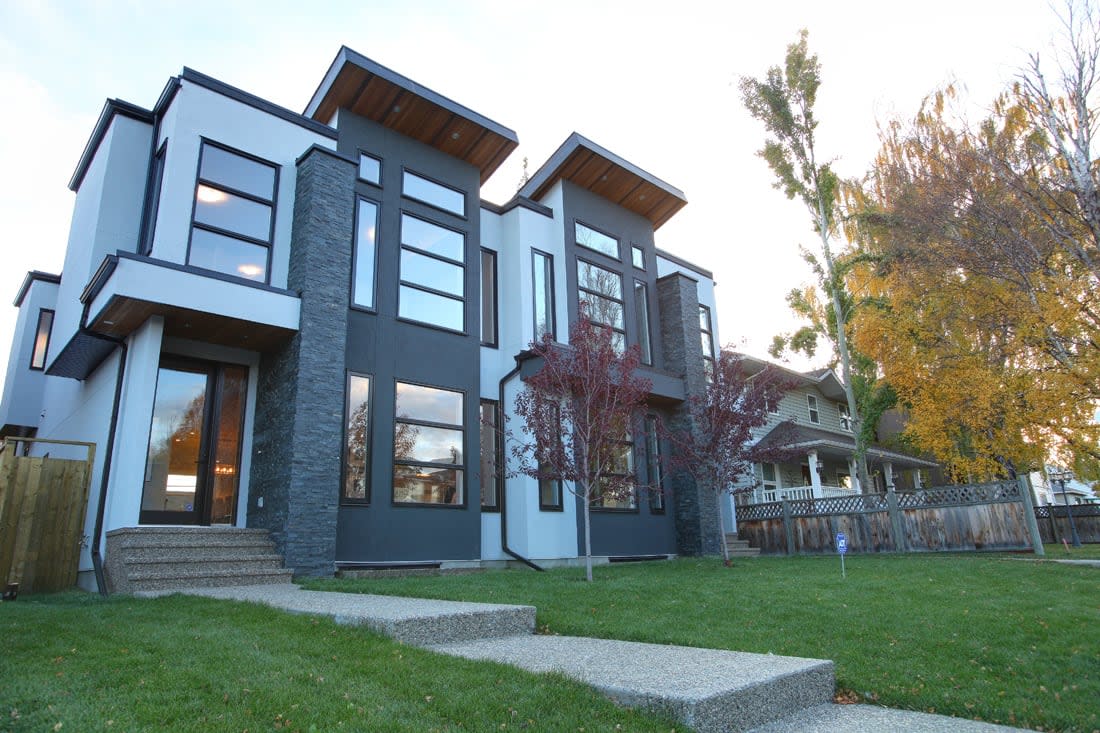 A newly constructed home next to an older home in a developed Calgary neighbourhood. (Robson Fletcher/CBC - image credit)