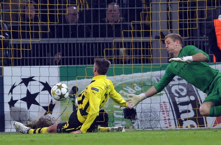 Dortmund striker Julian Schieber scores against Manchester City during their UEFA Champions League Group D match. The German side won 1-0 to dump City out of Europe. With their European season over, City will now focus entirely on defending their Premier League crown with the huge Manchester derby against leaders United next up on Sunday