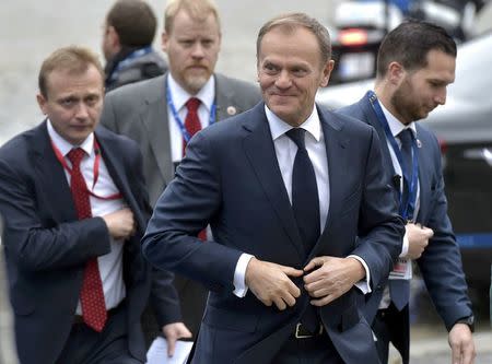 European Council President Donald Tusk, accompanied by his security detail, arrives at a European People's Party (EPP) meeting ahead of a EU summit in Brussels, Belgium, March 9, 2017. REUTERS/Eric Vidal