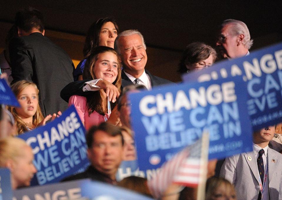 Joe Biden puts his arm around granddaughter Naomi Biden at the DNC