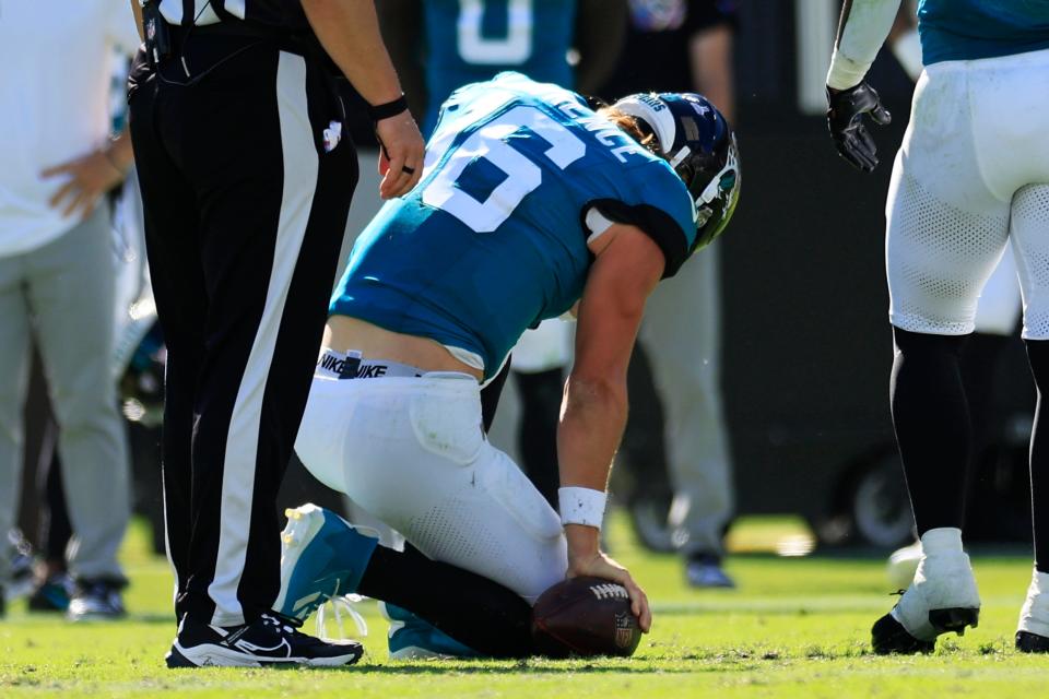 Jacksonville Jaguars quarterback Trevor Lawrence (16) is slow to get up after he was sacked trying to scramble out of trouble during Sunday's 37-20 victory over the Indianapolis Colts. His status for Thursday's game against the New Orleans Saints remains questionable.
